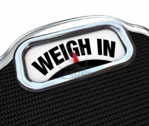 12844701-the-words-weigh-in-on-a-scale-representing-the-need-to-check-your-weight-while-dieting-and-watching-